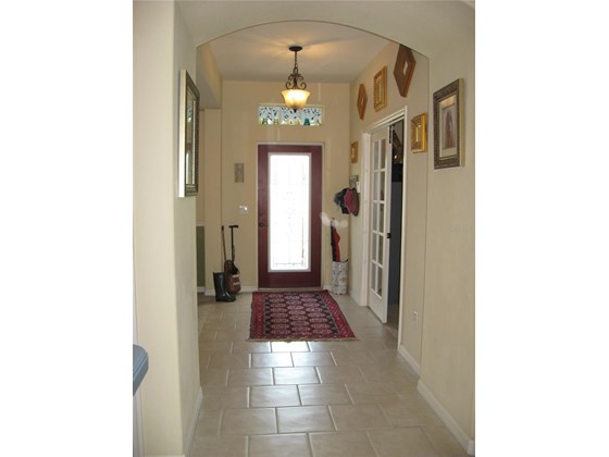 Entrance; office right, dining room left - Single Family Home for sale at 16922 Toledo Blade Blvd, Port Charlotte, FL 33954 - MLS Number is D6118673