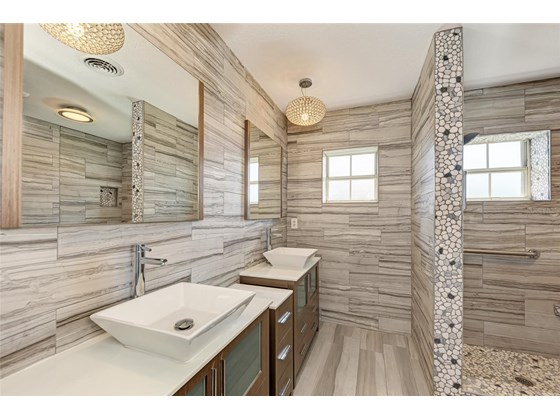 Bathroom first floor-left side - Single Family Home for sale at 949 Suncrest Ln, Englewood, FL 34223 - MLS Number is D6120396