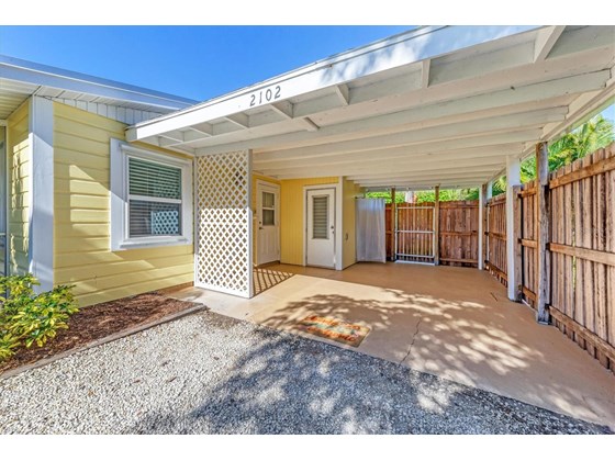 Outdoor shower, Laundry room and gate leading to backyard at 2102 Dakota Ave. Englewood FL 34224 - Single Family Home for sale at 2102 Dakota Ave, Englewood, FL 34224 - MLS Number is D6121750