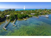 Home is on Beach/Gulf Side (Arrow), Deeded Dock First Come First Serve On Bay Side (circled) - Duplex/Triplex for sale at 4076 N Beach Rd #10 & 11, Englewood, FL 34223 - MLS Number is D6122744