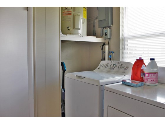 Indoor laundry room - Single Family Home for sale at 1345 Holiday Dr, Englewood, FL 34223 - MLS Number is C7449205