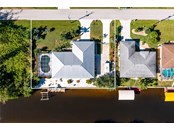 METAL ROOF, POOL, DOUBLE LOT, 140+ ON THE WATER, CEMENT SEAWALL, LIFT, DOCK, 2 DRIVEWAYS, FENCED SIDE YARD FOR EXPANSION OR STORAGE, CHECKS ALL THE BOXES ON YOUR LIST! - Single Family Home for sale at 3400 Colony Ct, Punta Gorda, FL 33950 - MLS Number is C7451906
