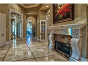 Marble Flooring with Mosaic Tile Inlays and Grande French Doors - Single Family Home for sale at 8499 Lindrick Ln, Bradenton, FL 34202 - MLS Number is A4475594