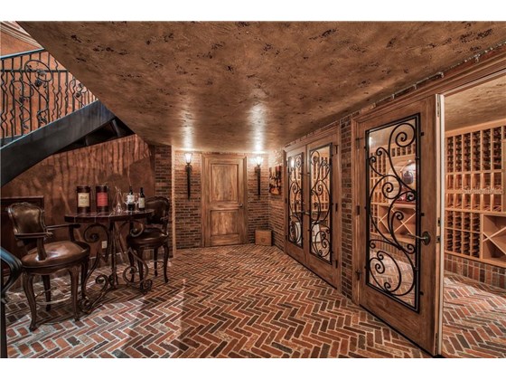 Wine Cellar with Authentic Brick and Pine Wood - Single Family Home for sale at 8499 Lindrick Ln, Bradenton, FL 34202 - MLS Number is A4475594