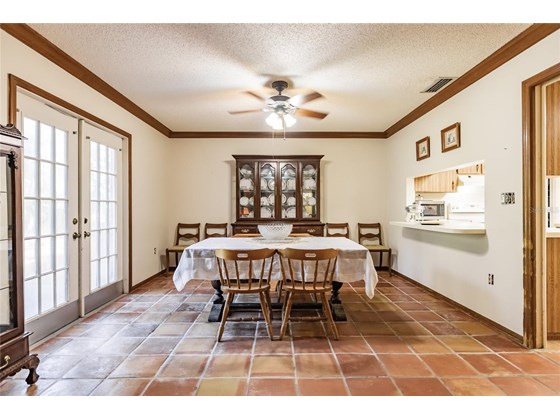 Formal dining room with kitchen pass-through - Single Family Home for sale at 7700 Iguana Dr, Sarasota, FL 34241 - MLS Number is A4512842