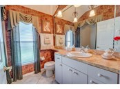 Second Bath with tub shared with second and third bedroom behind privacy pocket door - Single Family Home for sale at 6521 Sundew Ct, Lakewood Ranch, FL 34202 - MLS Number is A4514104