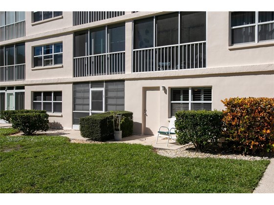 View looking back at your patio from the courtyard - Condo for sale at 244 Saint Augustine Ave #104, Venice, FL 34285 - MLS Number is A4518081