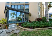 B107 is an end unit with a 15 x 15 enclosed lanai - Condo for sale at 450 Gulf Of Mexico Dr #B107, Longboat Key, FL 34228 - MLS Number is A4520786