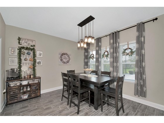 Dinette off the kitchen overlooking the pool and lake - Single Family Home for sale at 1113 Thornbury Dr, Parrish, FL 34219 - MLS Number is A4521922