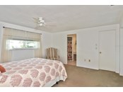 Master bedroom to master bathroom - Single Family Home for sale at 19 Oakwood Dr N #19, Englewood, FL 34223 - MLS Number is N6118266