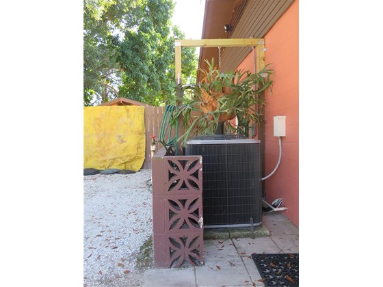 Side yard  AC 2020 - Single Family Home for sale at 4209 17th Ave W, Bradenton, FL 34205 - MLS Number is N6119166